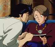 ryo taking a woman's bust measurements